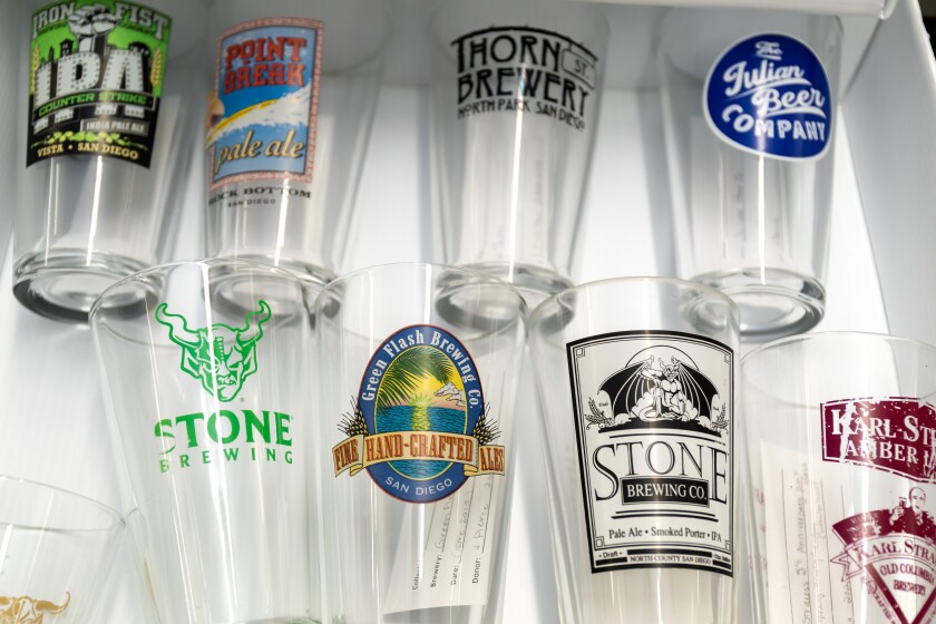 The Brewchive special collection at Cal State San Marcos includes dozens of printed logo glasses from San Diego breweries.