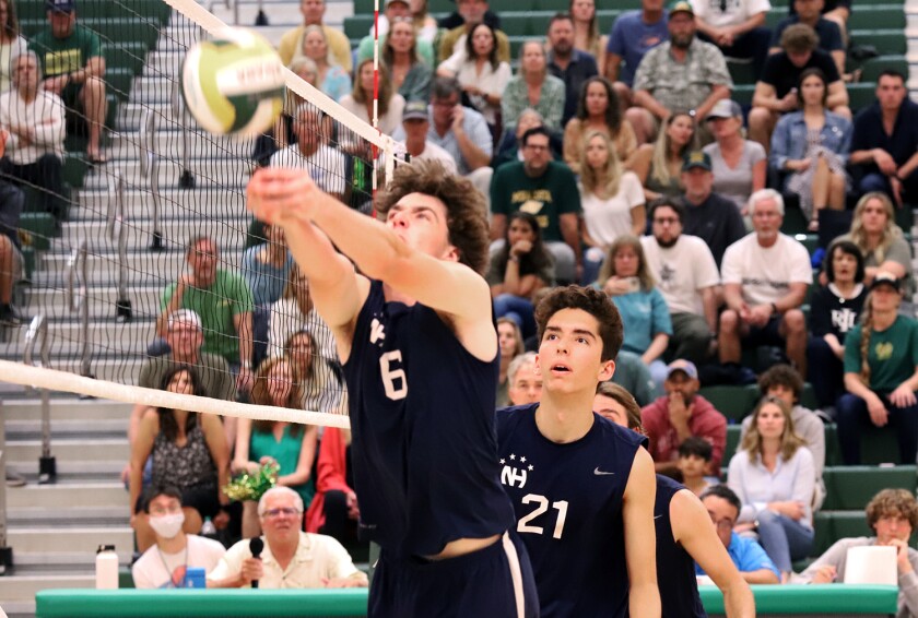 Newport Harbor's Jake Read (6) keeps a ball in play against Mira Costa on Saturday.