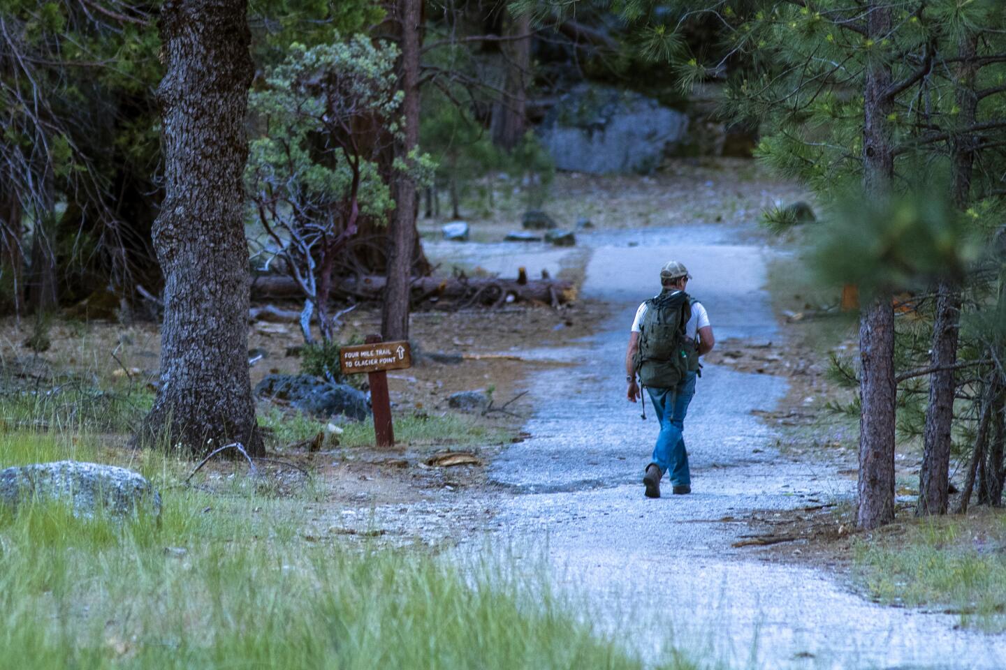 A hiker on Four Mile Trail in Yosemite Valley.