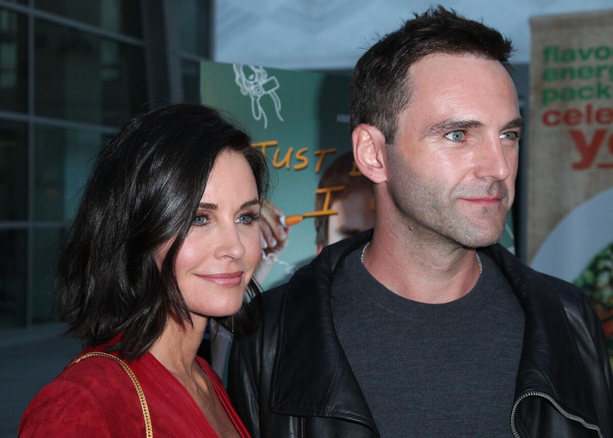 Actress/director Courteney Cox and songwritwer Johnny McDaid attend a screening of "Just Before I Go" in Hollywood on April 20, 2015.