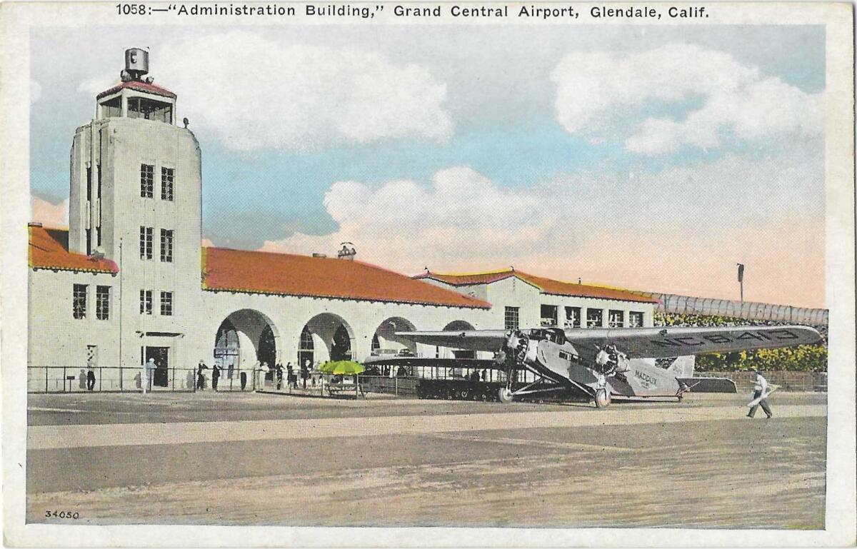 A tower and a building with tiled roof at Glendale's Grand Central Airport