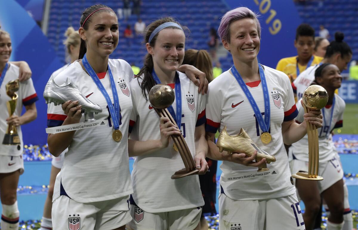 U.S. women's soccer players (from left) Alex Morgan, Rose Lavelle and Megan Rapinoe celebrate.