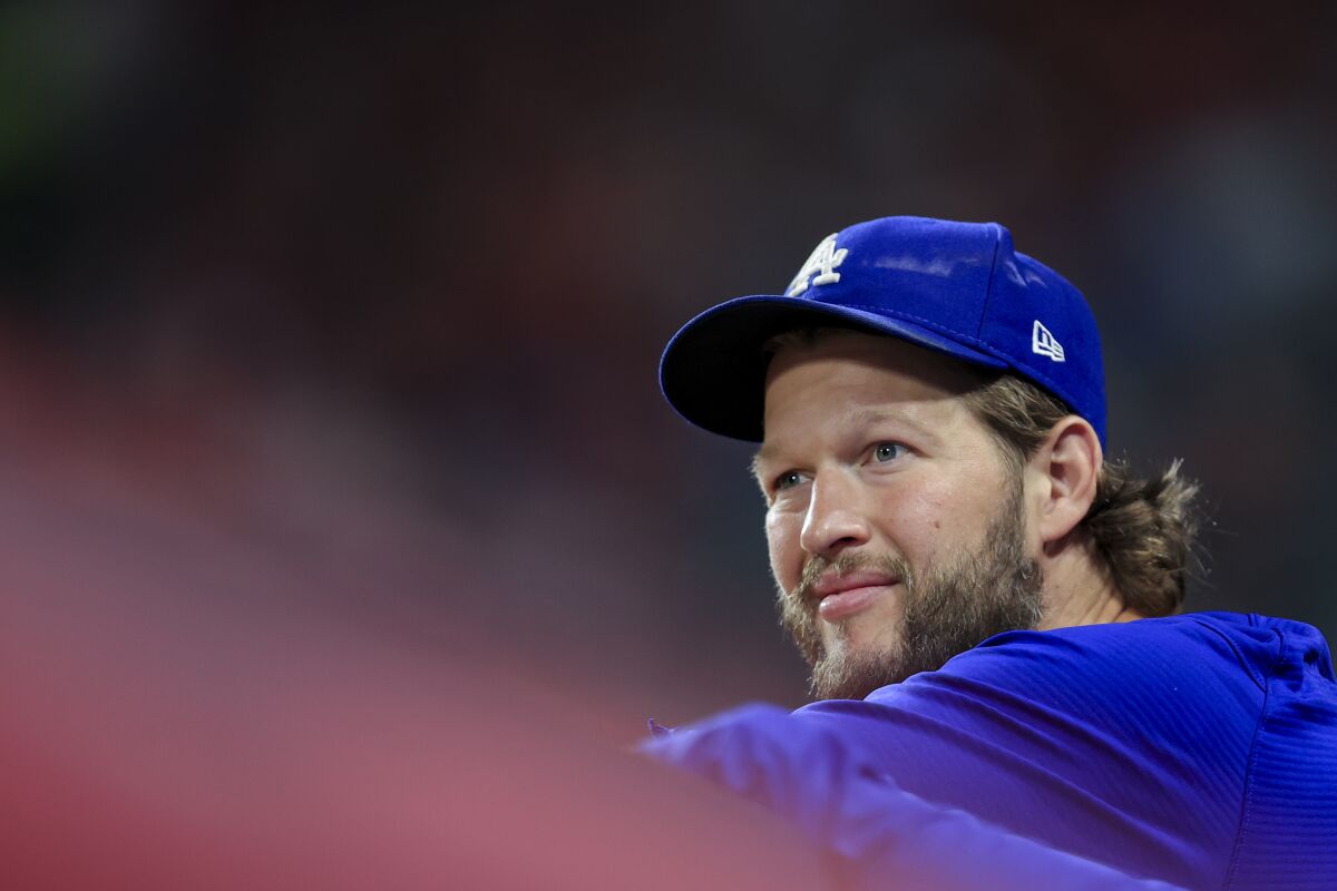 Clayton Kershaw looks on from the dugout during a game.