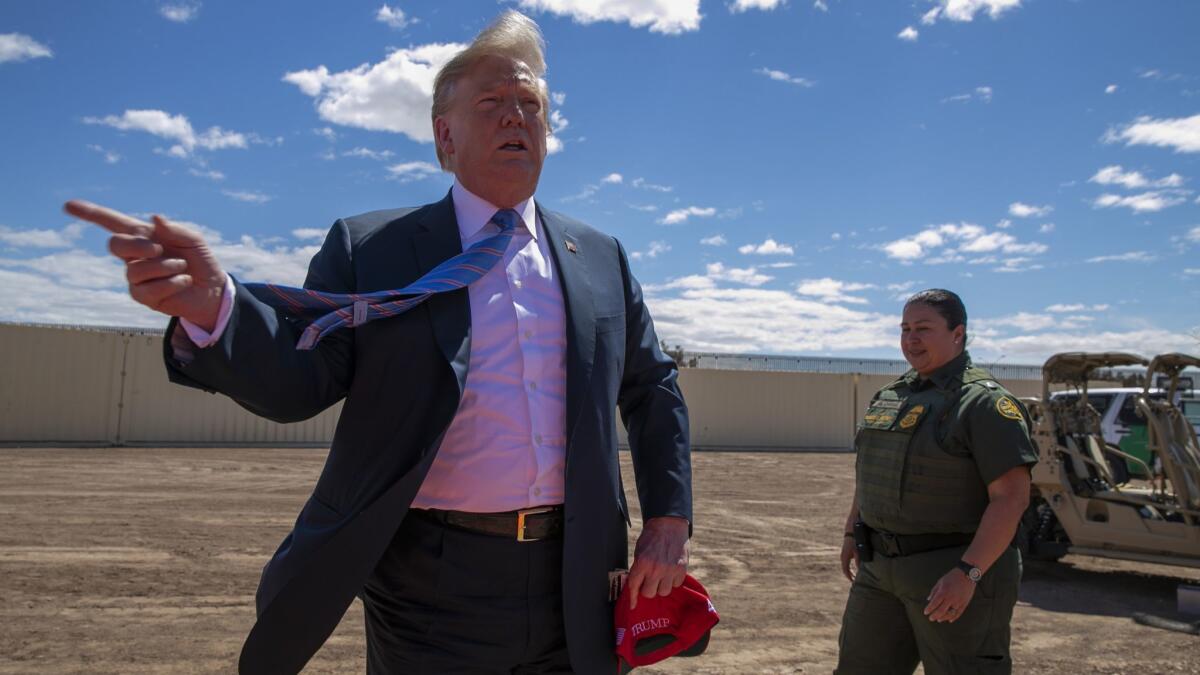 President Trump visits a new section of border wall in Calexico, Calif., in April. A federal appeals court said Wednesday that the administration may not use Pentagon funds to pay for the wall.