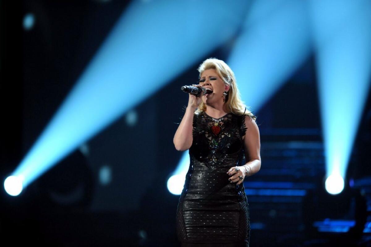 Kelly Clarkson performs a medley of her songs at the 40th Annual American Music Awards in Los Angeles. Clarkson and fun. are just two of the acts performing at the inaugural festivities.