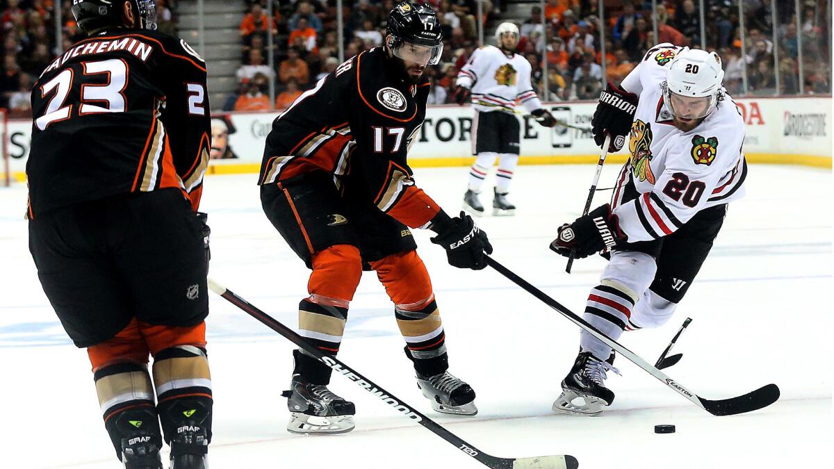 Ducks center Ryan Kesler is called for slashing as he shatters the stick of Blackhawks winger Brandon Saad in the second period of Game 7.