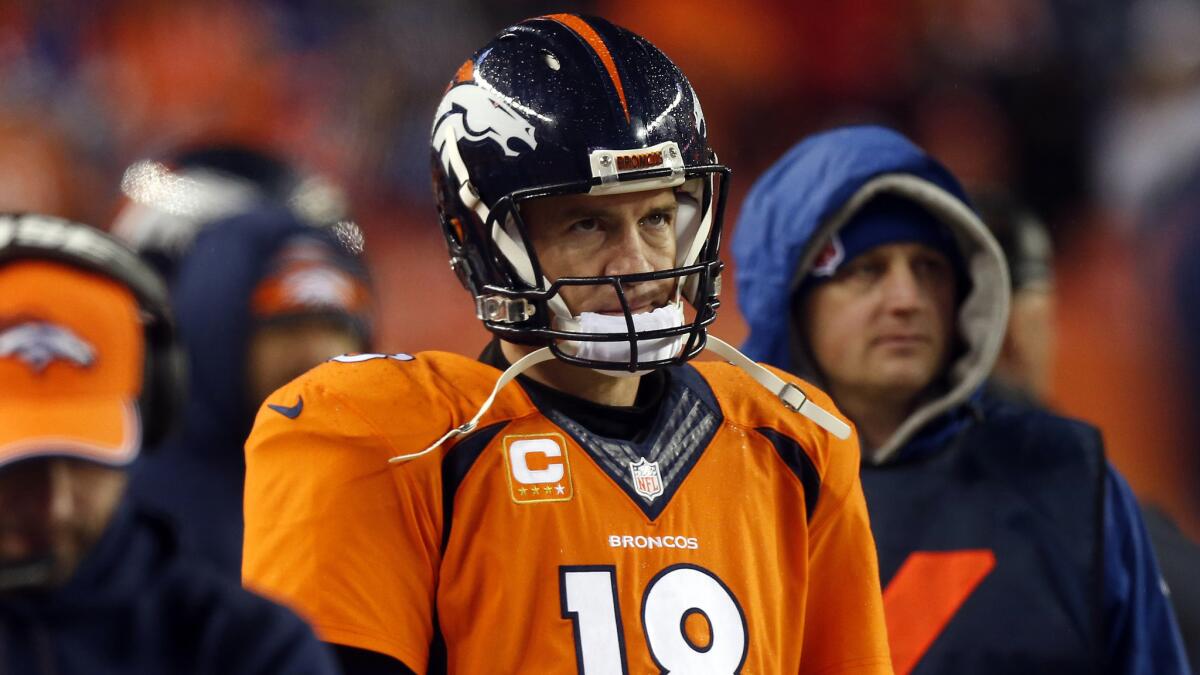 Denver Broncos quarterback Peyton Manning watches from the sideline during the final seconds of a 24-13 loss to the Indianapolis Colts in the AFC divisional playoffs on Jan. 11.