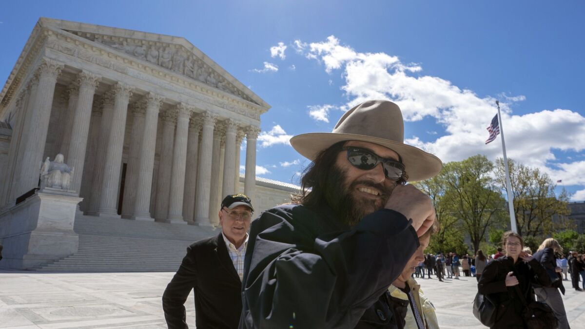 Los Angeles artist Erik Brunetti, the founder of the streetwear clothing company "FUCT," leaves the Supreme Court after his trademark case was argued, in Washington on April 15.