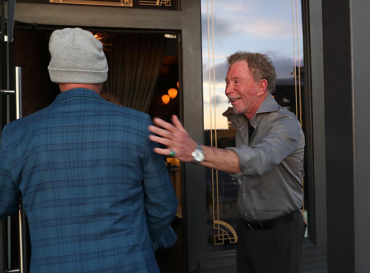 Owner and founder Alec Glasser welcomes guests to the Drake restaurant.