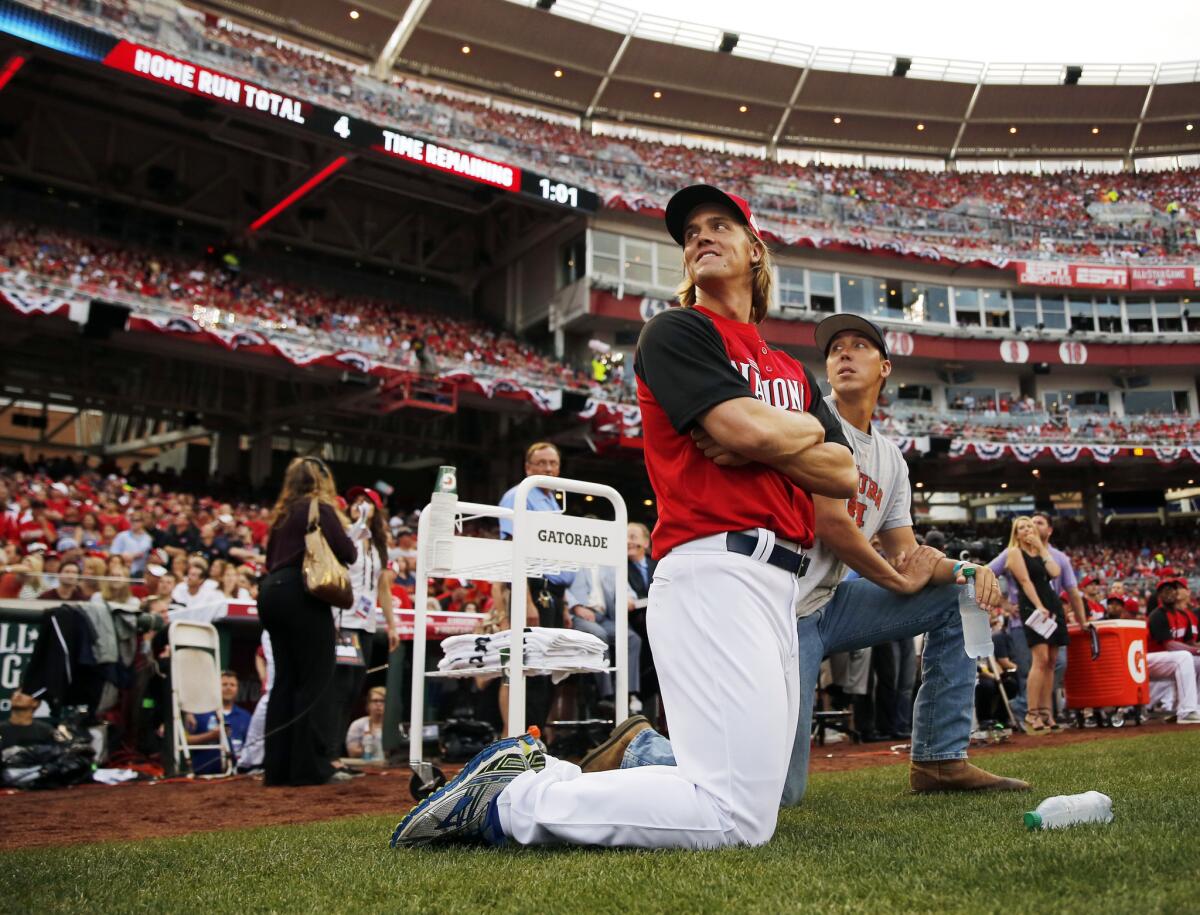 Dodgers pitcher Zack Greinke watches the MLB All-Star home run derby on Monday.