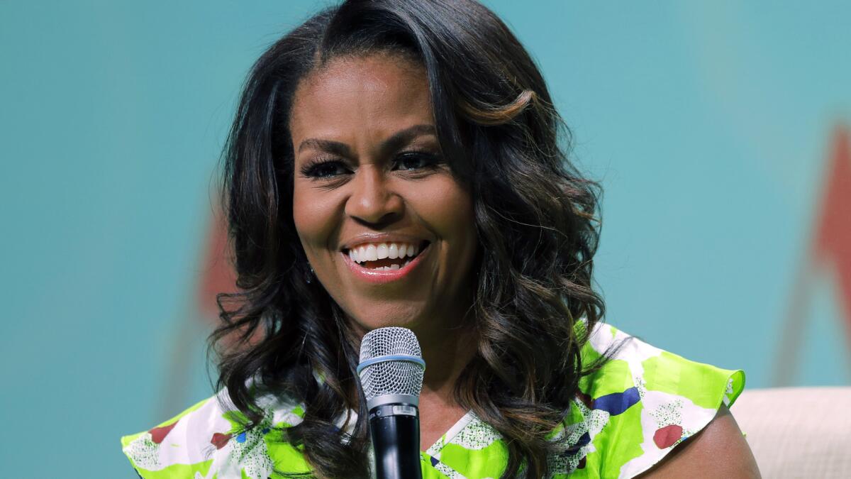 Michelle Obama spoke at a library conference in June; her memoir "Becoming" publishes in November.