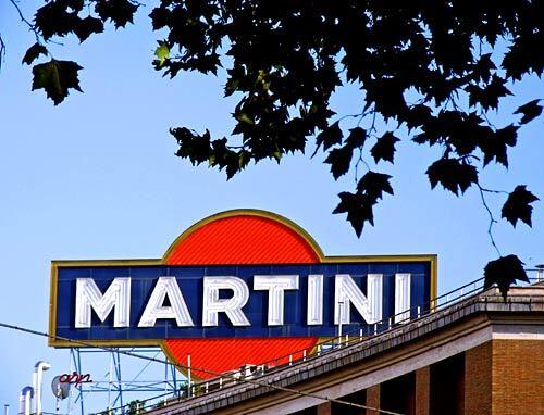 A marquee advertises Martini & Rossi on Via Veneto in Rome.