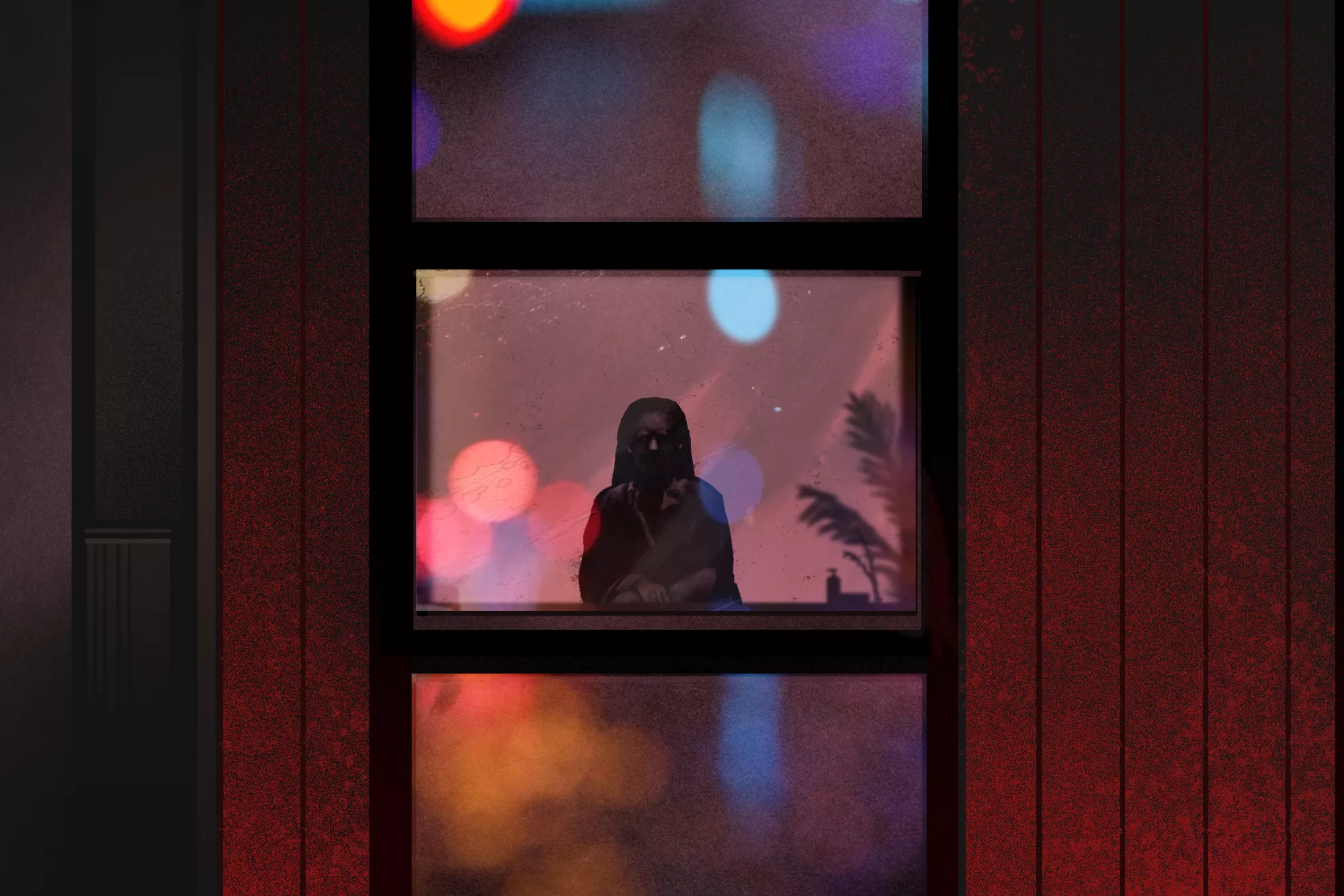Silhouette of a seated woman seen through a window with red and blue lights reflected in the glass
