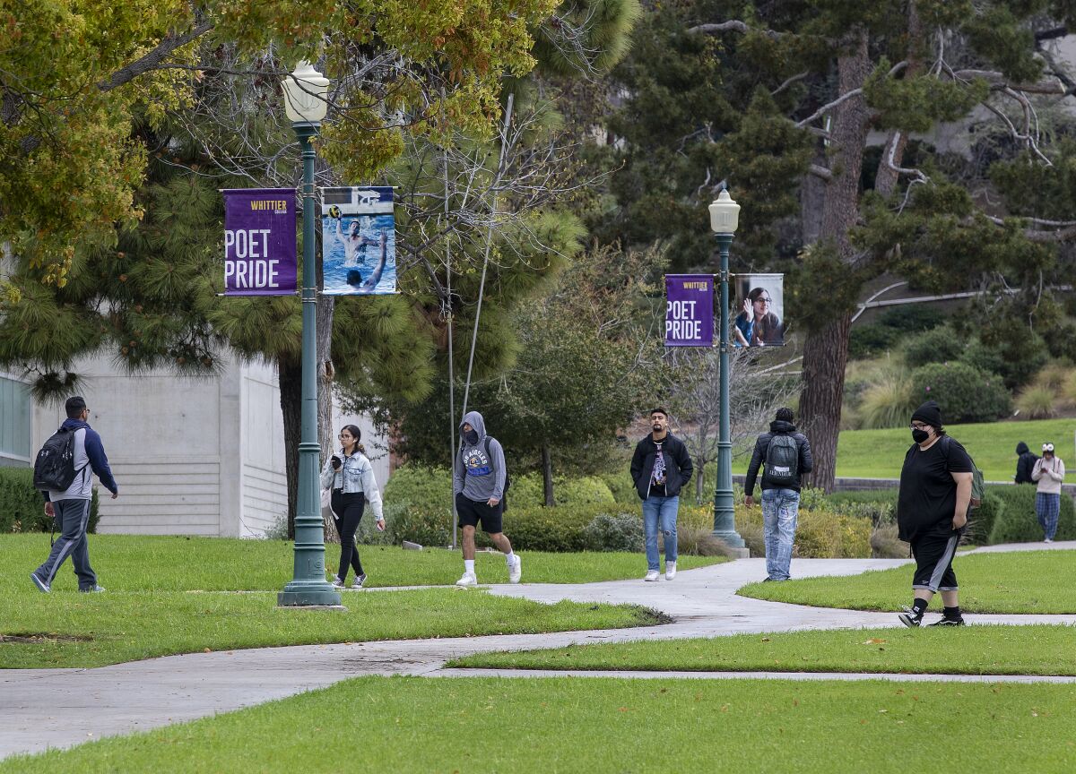 Students walk on the campus of Whittier College.