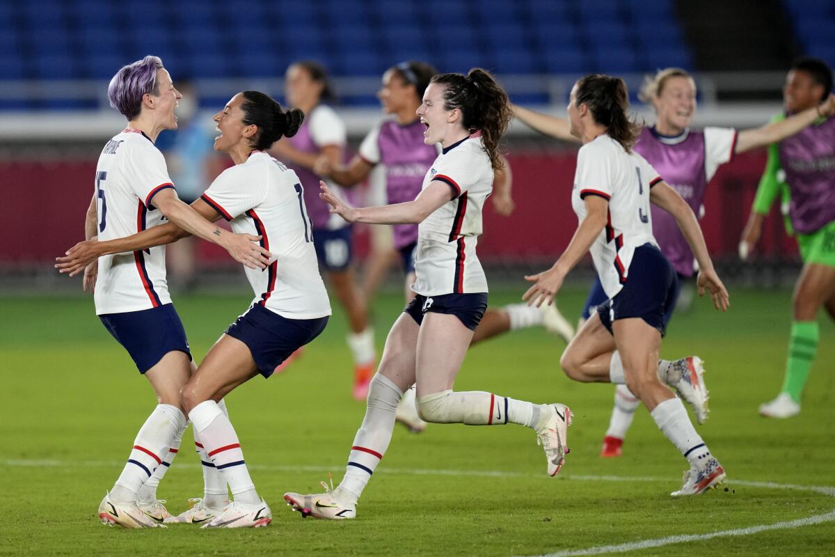 Megan Rapinoe, left, celebrates with her U.S. teammates after scoring in a shootout to defeat the Netherlands on Friday.