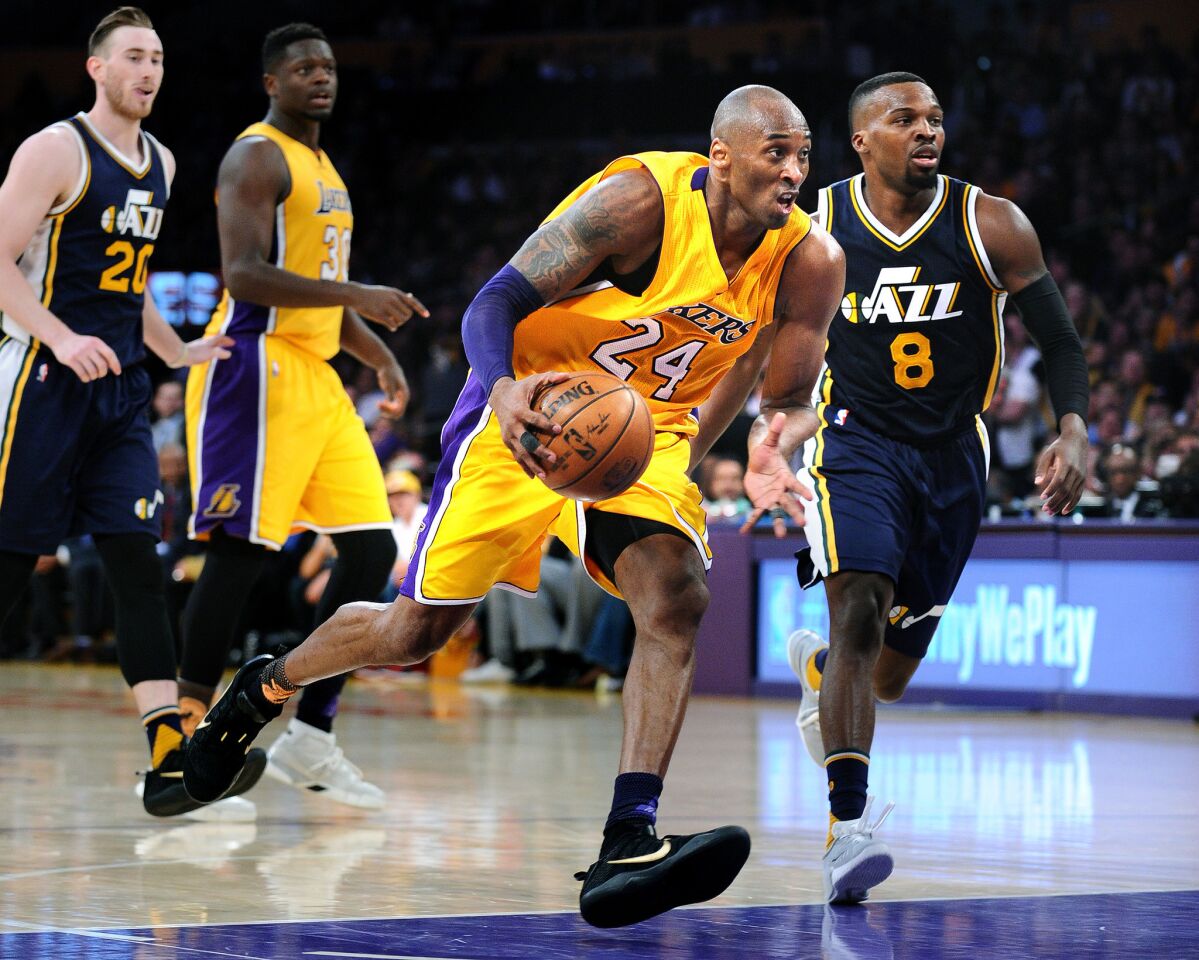 Kobe Bryant drives the ball in the third quarter of his final game at the Staples Center Wednesday.