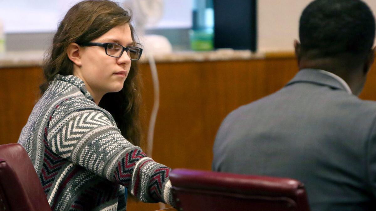 Anissa Weier passes a note to defense attorney Joseph Smith Jr. during closing arguments Friday in Waukesha, Wis.