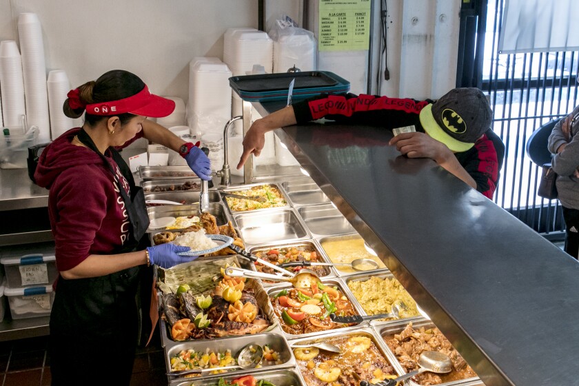 A customer makes his selection at Greenhills Market & Fast Food