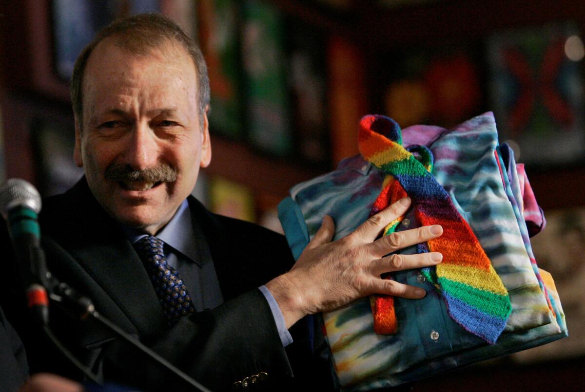 UC Santa Cruz Chancellor George Blumenthal shows off a tie and shirts given to him by the Grateful Dead at a 2008 news conference in San Francisco.