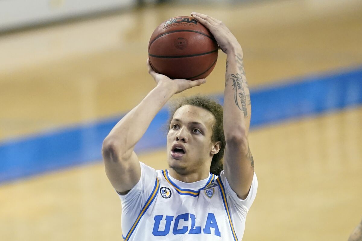 UCLA forward Mac Etienne shoots the ball.