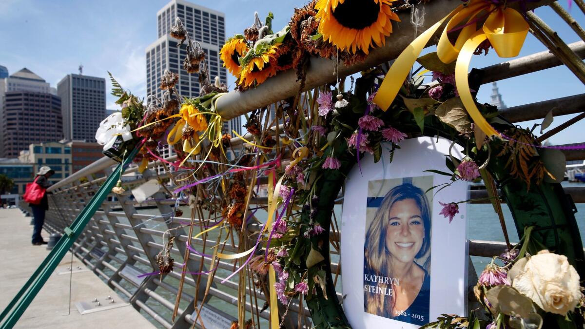 Flowers and a portrait of Kate Steinle placed at a memorial on Pier 14 in San Francisco on July 17, 2015.