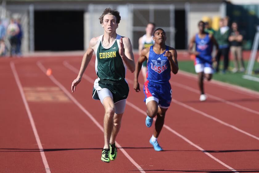 Edison's Ryan Riuituso eyes the finish line in route to winning the boys' 400 meter run during Surf League dual meet against Los Alamitos on Wednesday.