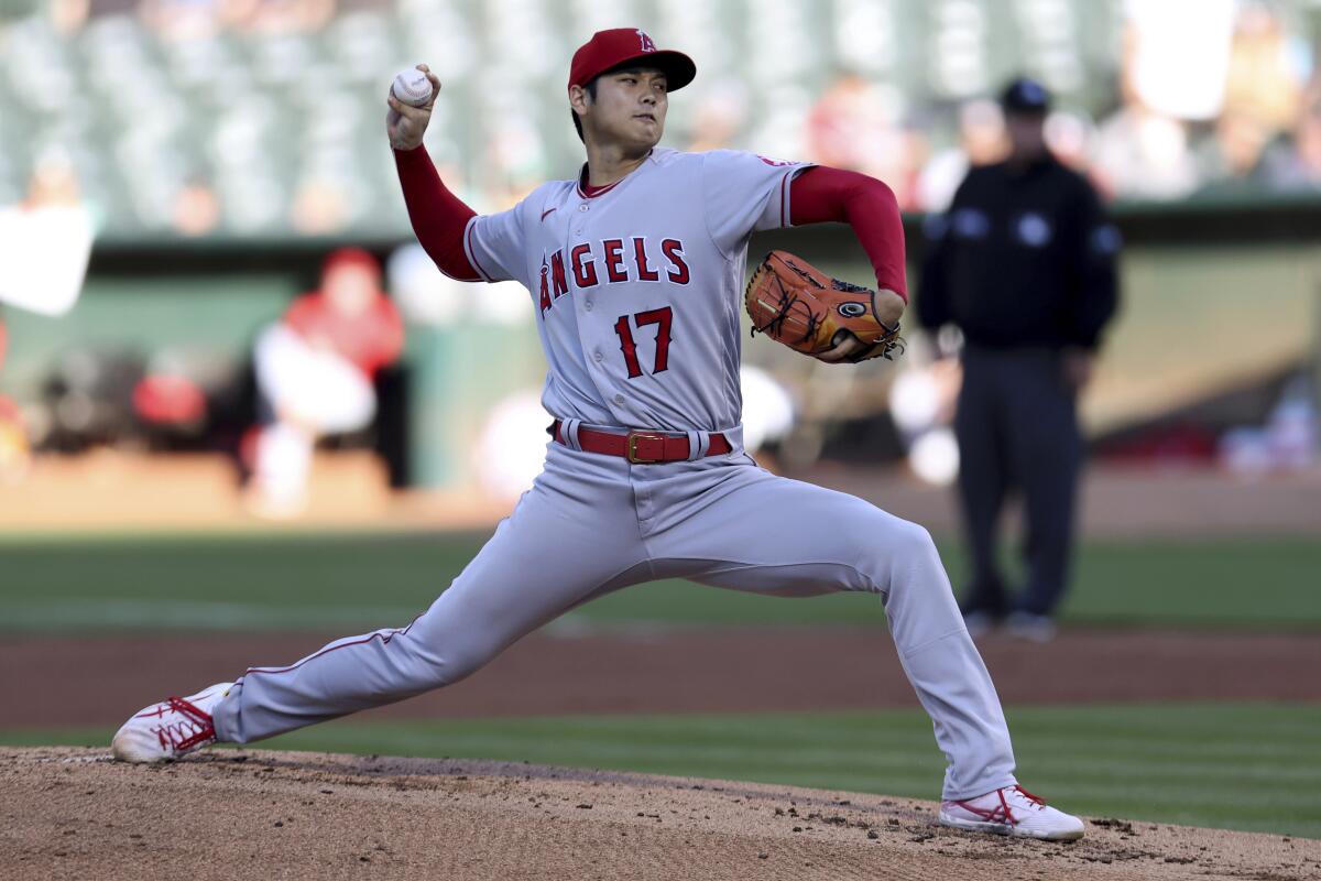 Angels pitcher Shohei Ohtani throws to an Oakland Athletics batter.