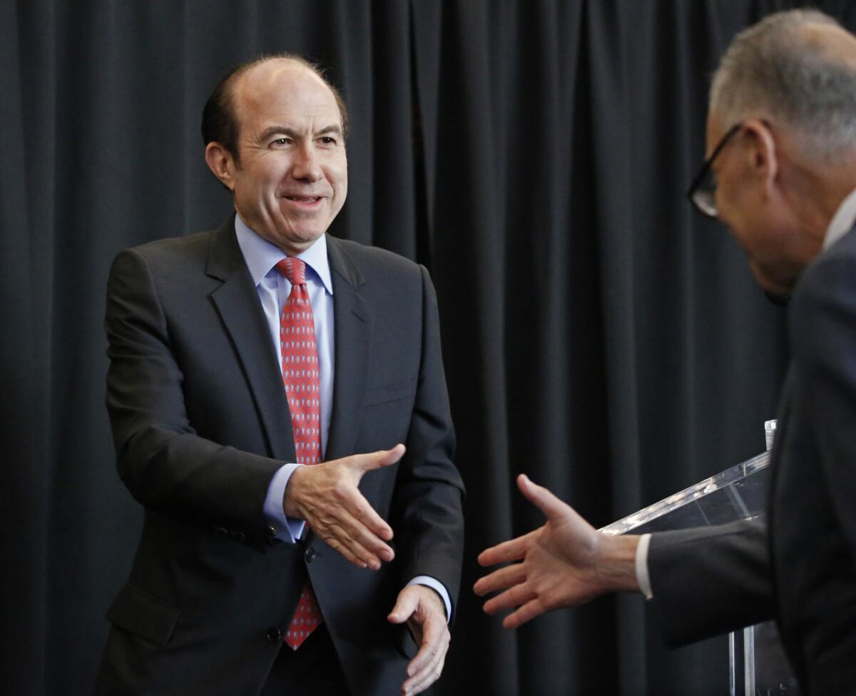 Viacom released its fiscal first-quarter earnings Tuesday, nearly a week after Viacom board members elected CEO Philippe Dauman to serve as chairman of the media company. Here, Dauman, left, greets Sen. Charles Schumer (D-New York) in 2014.