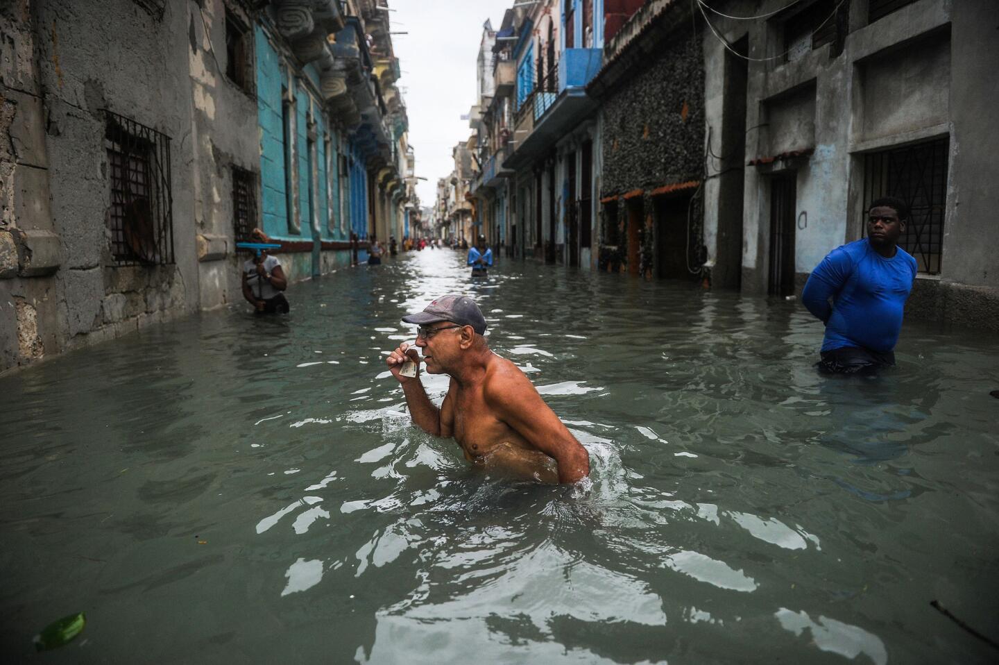 A Cuban wades through a flooded street in Havana on Sept. 10, 2017.
