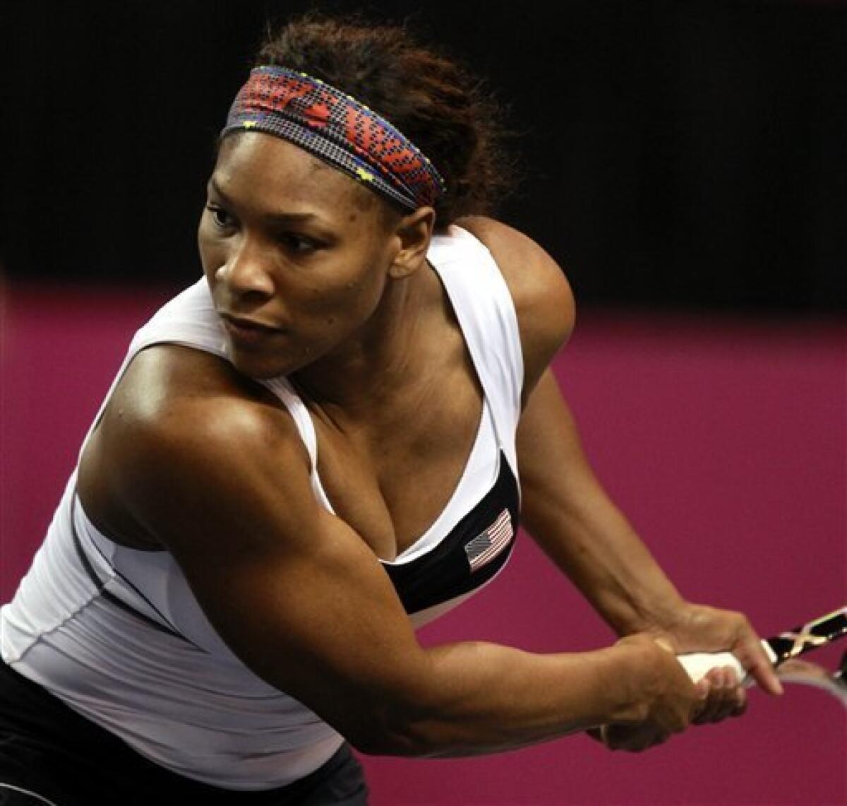 Serena Williams returns a ball to Anastasia Yakimova, of Belarus, during a first-round Fed Cup tennis match in Worcester, Mass., Sunday, Feb. 5, 2012. Williams defeated Yakimova 5-7, 6-1, 6-1. (AP Photo/Steven Senne)