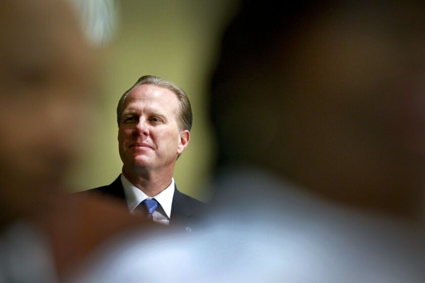 Kevin Faulconer, the 36th mayor of San Diego listens as the Mount Erie Baptist Church Choir sings the National Anthem during his swearing-in ceremony during a special session of the San Diego City Council.