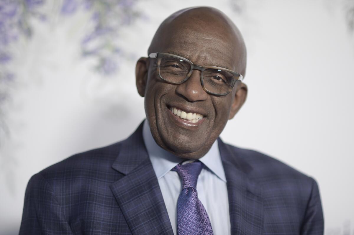 Al Roker smiles while wearing glasses and a dark suit