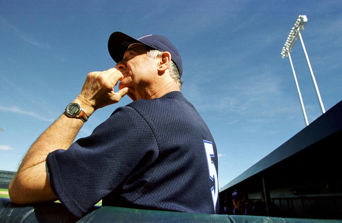 Sam Suplizio watches from the dugout during a spring training game between the Angels and Oakland Athletics.