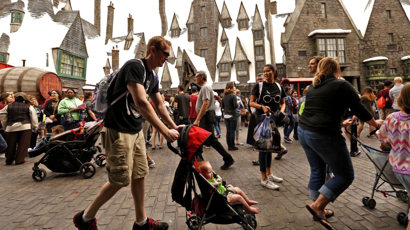 Crowds grow as the public is allowed to enter the Wizarding World of Harry Potter attraction for the first time.