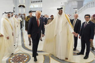 Qatar's emir, Sheikh Tamim bin Hamad Al Thani, welcomes President Trump in Doha, Qatar, on Wednesday.