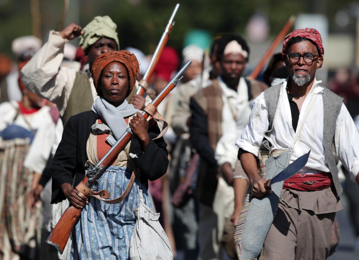 A group stages a reenactment Saturday tracing the route of an 1811 slave rebellion in Louisiana. 