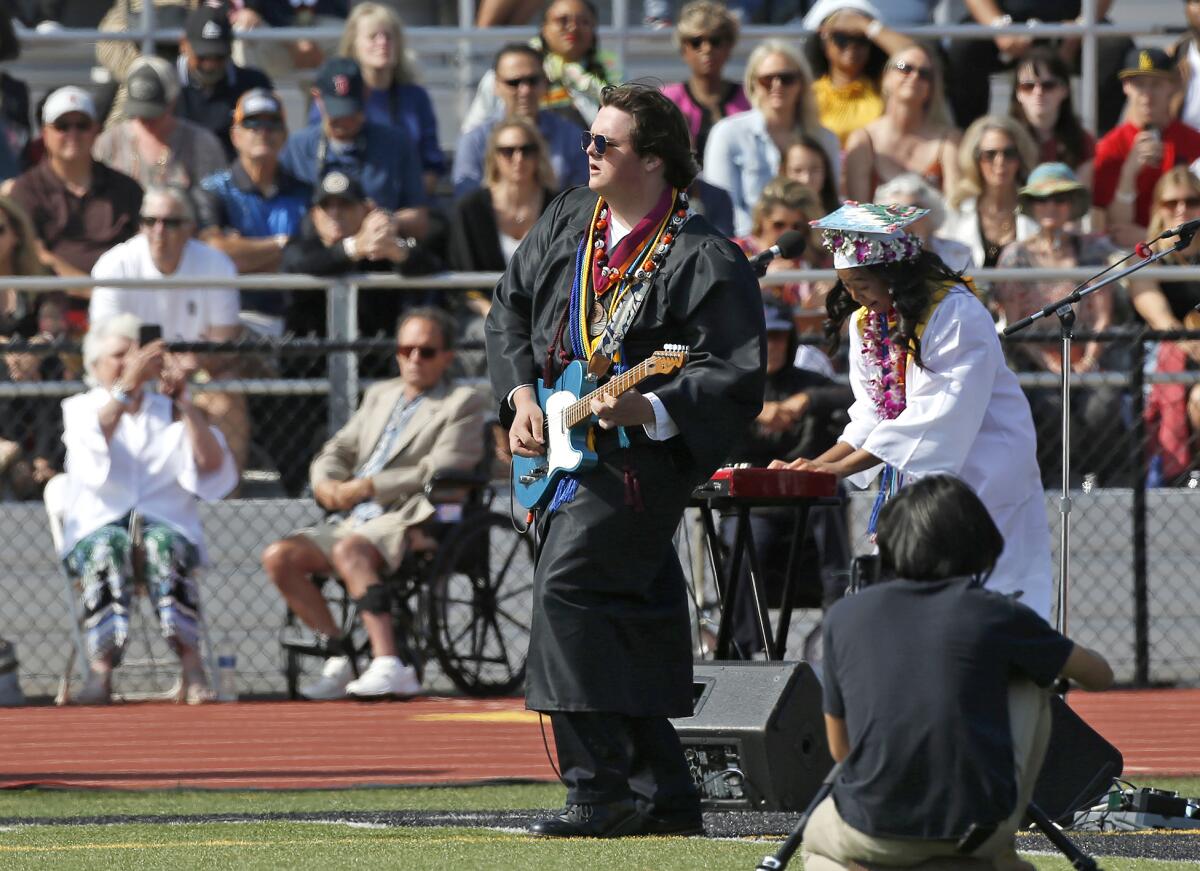 Daniel Bronder of the Huntington Beach Academy for the Performing Arts plays a guitar solo during Tuesday's ceremony.