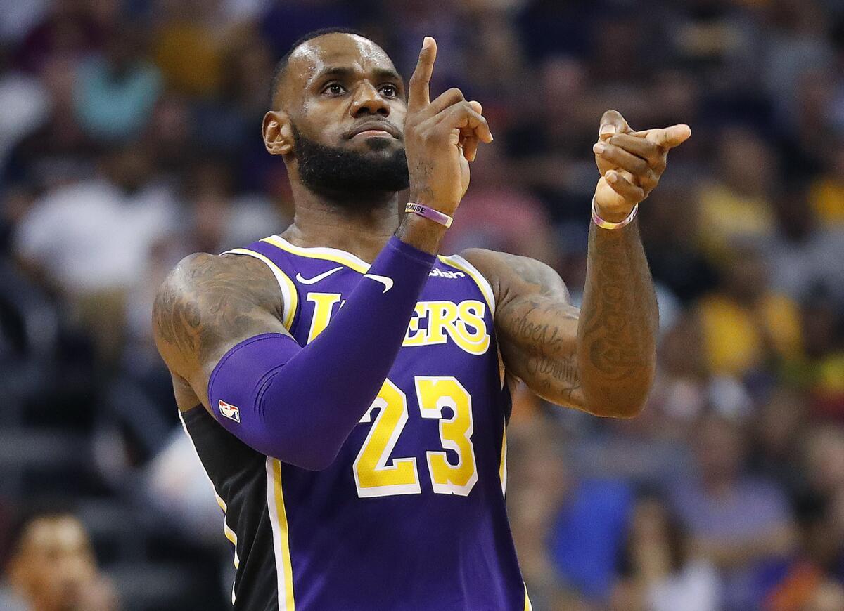 Lakers forward LeBron James celebrates a basket against the Phoenix Suns.