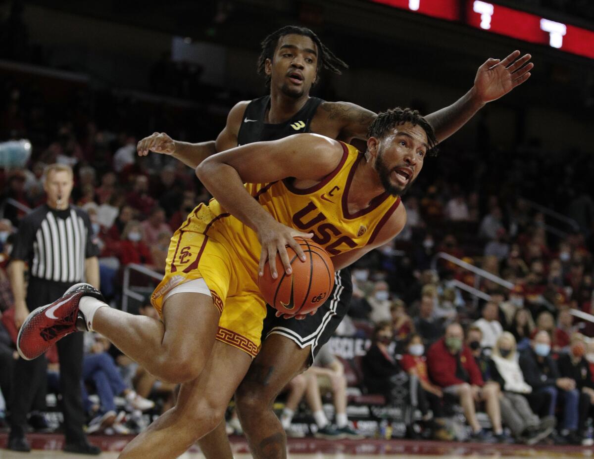 USC forward Isaiah Mobley drives to the basket against Long Beach State forward Jordan Roberts.