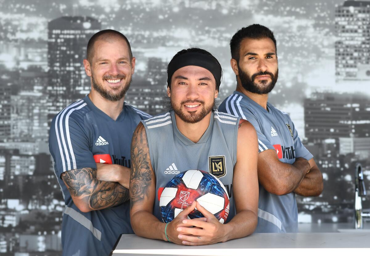 From left, LAFC players Jordan Harvey, Lee Nguyen and Steven Beitashour sport beards until they win their first playoff game.