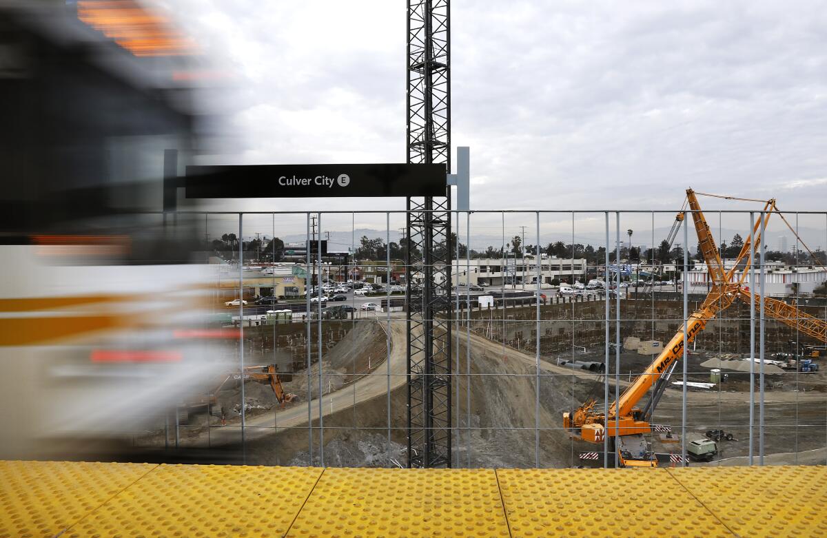 A Metro Expo Line train passes by construction in Culver City on Jan. 3, 2017.