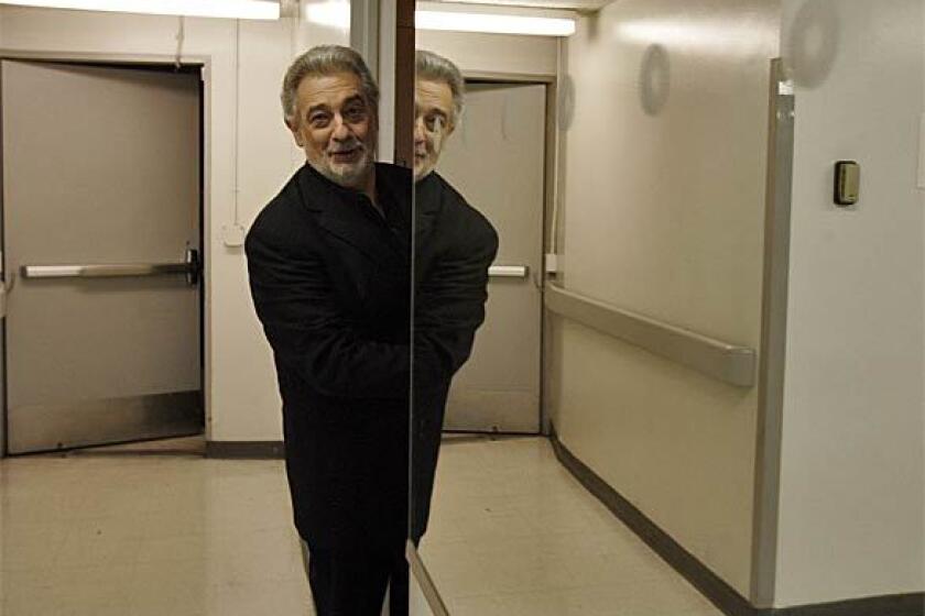 Placido Domingo ducks into his dressing room before the April 18 concert celebrating the passage of four decades since he first sang the title role in Alberto Ginasteras Don Rodrigo with the New York City Opera in the Dorothy Chandler Pavilion.