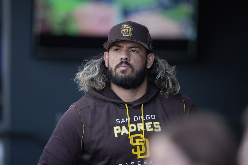 San Diego Padres catcher Jorge Alfaro looks on before a baseball game against the Colorado Rockies, Friday, Sept. 23, 2022, in Denver. (AP Photo/David Zalubowski)