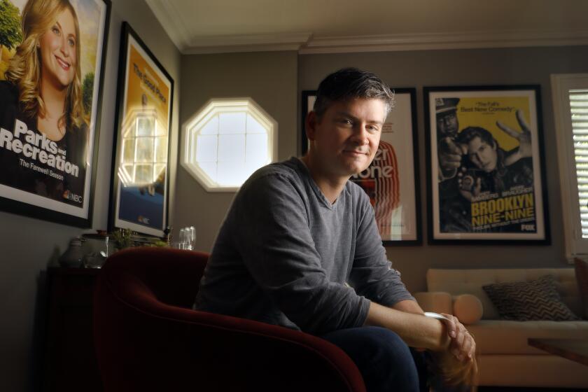 LOS ANGELES, CALIFORNIA--SEPT. 3, 2019--Michael Schur is the creator and show- runner of NBC's "The Good Place." Schur photographed at his office at Universal on September 3, 2019 where his has many keepsakes. (Carolyn Cole/Los Angeles Times)