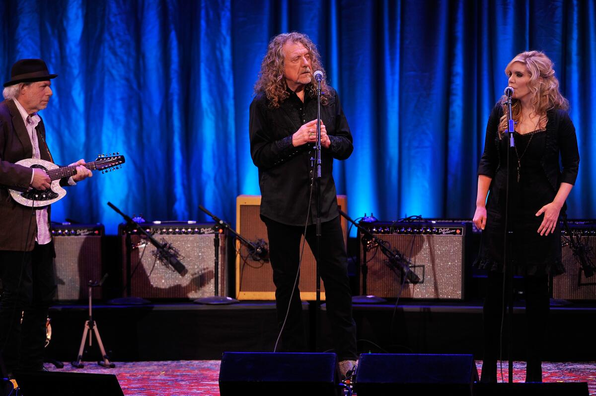 Robert Plant (center) and Alison Krauss, with guitarist Buddy Miller