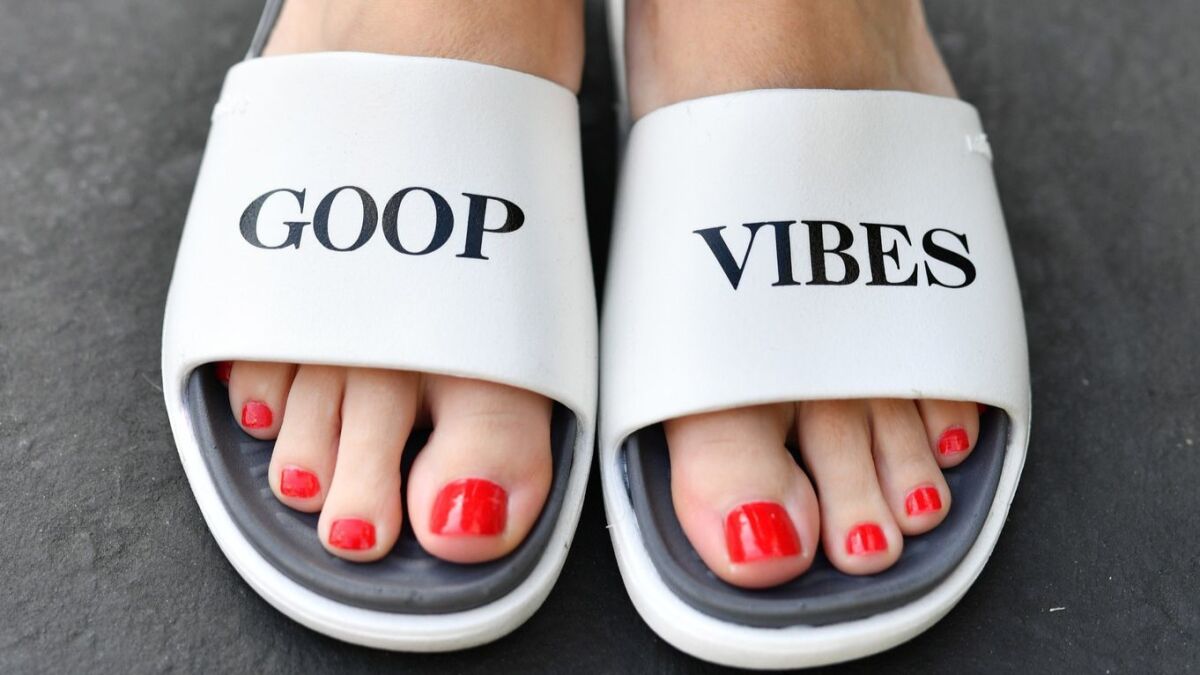 A guest wears Goop Vibes sandals during the In Good Health summit on Saturday.