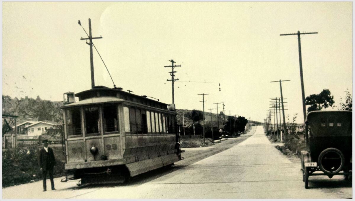 Looking north on Rosecrans Street, the Point Loma Railroad’s La Playa Local waits at the Fort Rosecrans gate circa 1918.