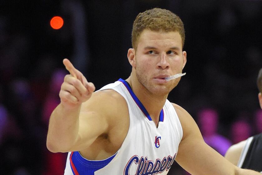 Clippers forward Blake Griffin points at members of the Brooklyn Nets before the start of a game Jan. 22 at Staples Center.