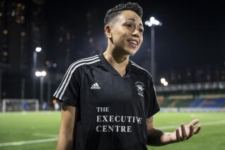 Gina Benjamin, vice captain of a Women's seven-a-side team, speaks during an interview in Hong Kong, Tuesday, Oct. 31, 2023. Set to launch on Friday, Nov. 3, 2023, the first Gay Games in Asia are fostering hopes for wider LGBTQ+ inclusion in the Asian financial hub. (AP Photo/Chan Long Hei)