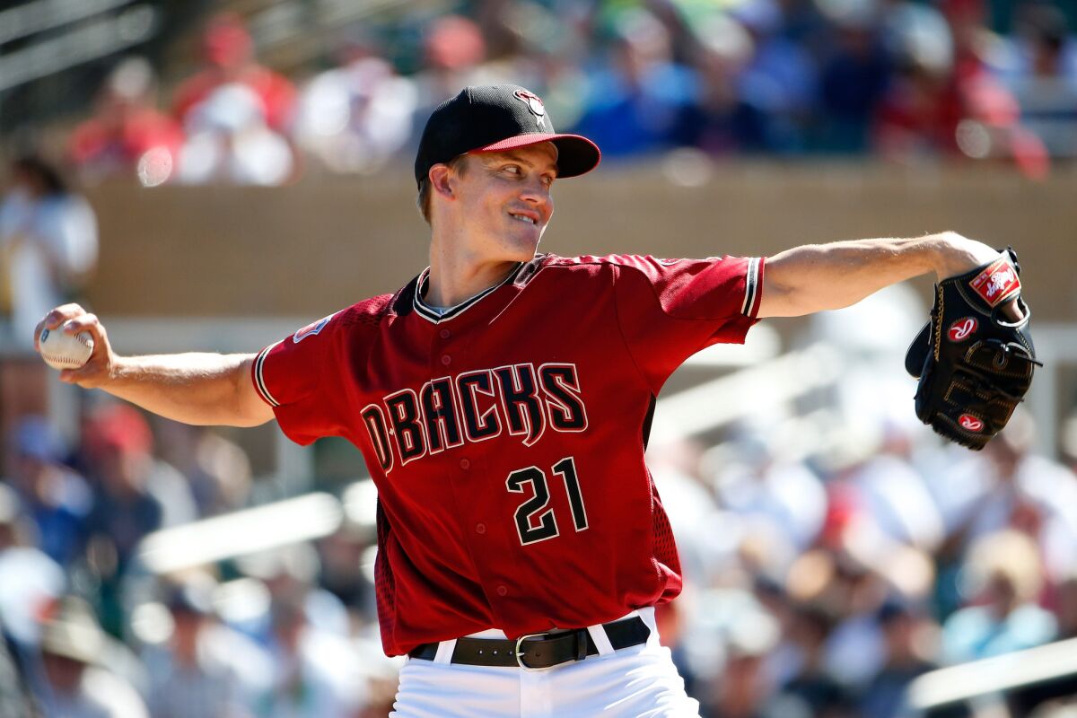 Diamondbacks starting pitcher Zack Greinke throws a pitch during the second inning of a spring training game against the Oakland Athletics on March 4.